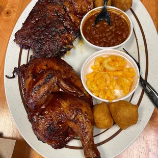 Half chicken, ribs, Mac n cheese, baked beans, hush puppies