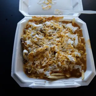 It's not slop! This is some of the best Green Chile Cheese fries with Carne Asada in Denver. 10 bucks and can feed a family of 4. Spicy!