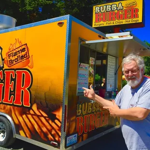 a man standing in front of a food truck