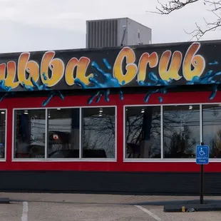 a car parked in front of a restaurant