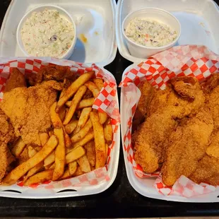Two large catfish dinners with Cajun fries and coleslaw.
