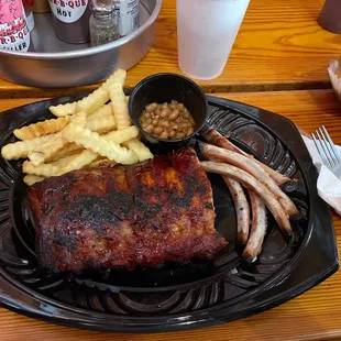 Baby back dinner. Partially eaten. Couldn't help myself, it's so good