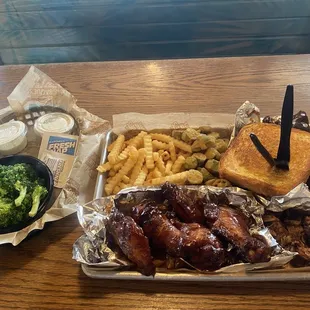 Three meats entree. Chicken Wings, brisket, St. Louis ribs, crinkled fries, fried okra and broccoli  Pick Any Three Items