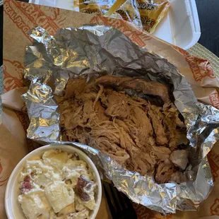 1/2 lb pulled pork: $7.99.  Small potato salad. Both were excellent