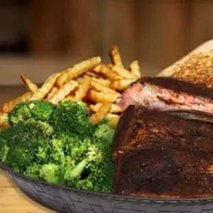 a grilled steak and french fries