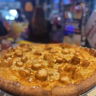 a pizza on a cooling rack