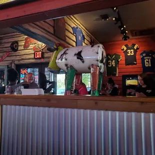 a cow statue in a bar