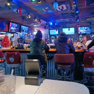 people sitting at the bar