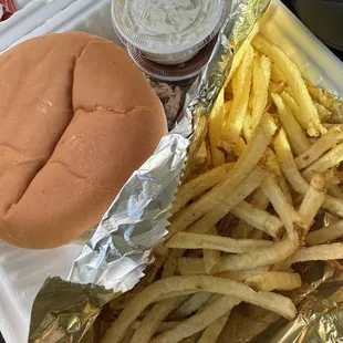 Pulled Pork Shoulder Sandwich with fries.