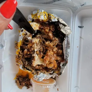 spud with chopped brisket and Rickey's special sauce