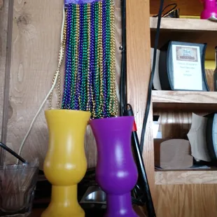 a purple vase and a yellow vase