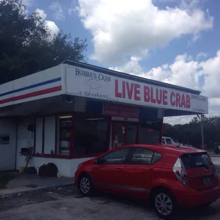 Front of building. Great prices. Cook your own.