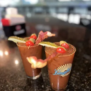 a closeup of two glasses with a bloody drink