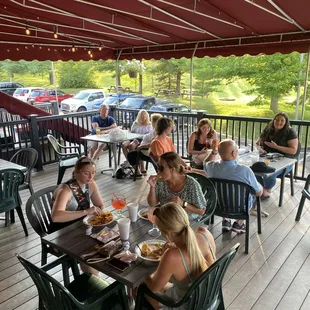 a group of women sitting at a picnic table