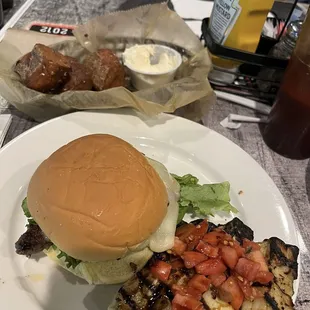 Mushroom Swiss smash burger with zucchini side.