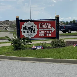  a sign in front of a parking lot