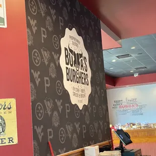  a bar with a menu on the wall