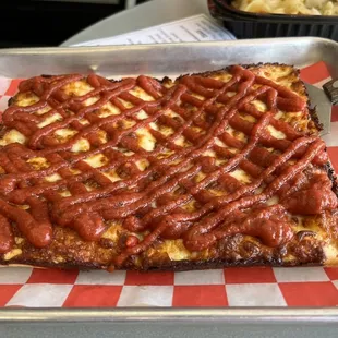 Four-slice pizza, plain. Note: sauce atop the cheese.