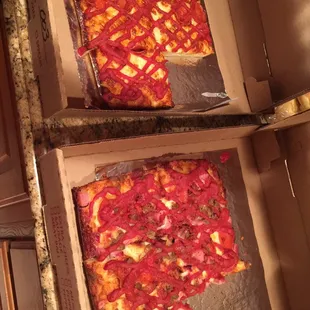 two pizzas in a pizza box