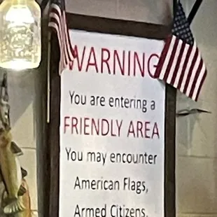 a warning sign in a restaurant
