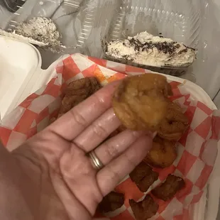 The amount of greasy from the shrimp on my fingers as I picked it up.