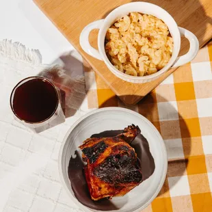 a bowl of macaroni and cheese and a plate of ribs