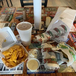 Cheese steak, cheese fries, Polish sausage, fried green beans, cup of ranch, and Arnold Palmer (half sweet tea, half pink lemonade)