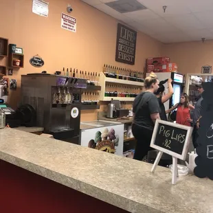 a man and a woman behind a counter