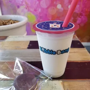 Small coconut smoothie no pearls with honey lavender macaron. Perfect smoothie and the macaron taste lingers afterwards.