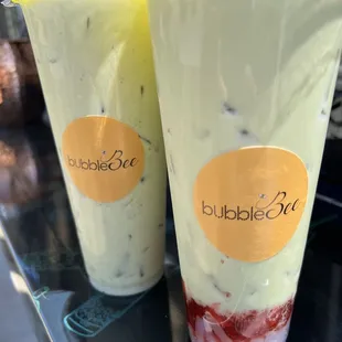 two cups of bubble tea on a table