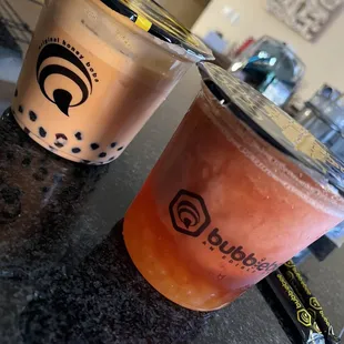 two drinks sitting on a counter