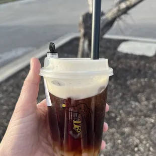 Foamy Oolong tea with lychee, less ice and less sugar.