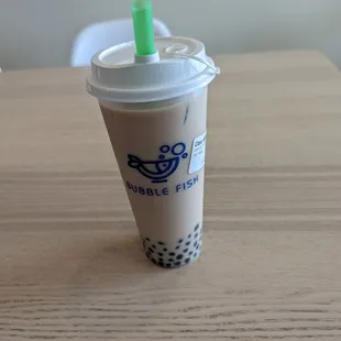 a cup of bubble tea on a table
