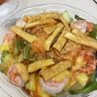 1/2salad1/2rice poke bowl w/ spicy salmon, shrimp, avocado, cucumber, mango sauce&amp;mango,pineapples topped w/wonton crisps&amp;crunchy onions.