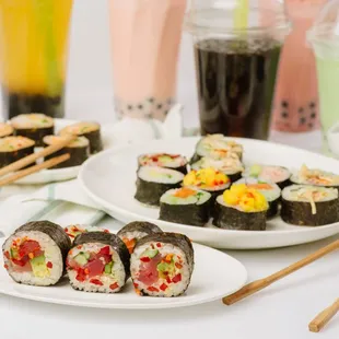 a variety of sushi on plates