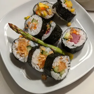 A few pieces from The crunchy avocado tuna roll, the crunchy wasabi salmon roll, and the mango shrimp roll