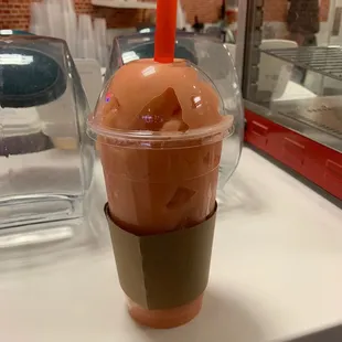 a plastic cup with ice cream in it