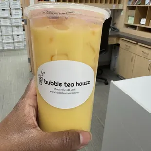 Passion Fruit Milk Tea with honey popping boba
