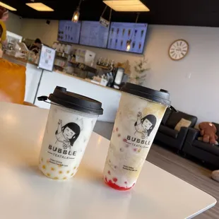 two cups of bubble tea on a table
