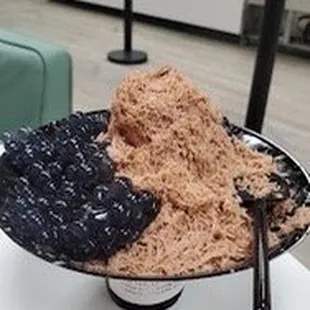 a bowl of ice cream and a scoop of ice cream