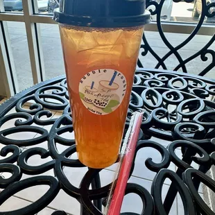 Tea with sugar free mango syrup and passion fruit boba