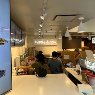 a group of people sitting at a counter