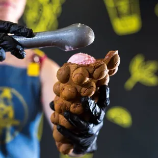 a woman holding a baseball bat and a doughnut