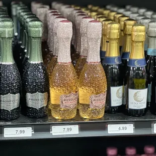 bottles of sparkling wine on a shelf