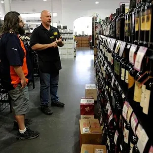 two men in a wine store