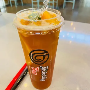 a cold beverage in a plastic cup