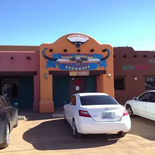 cars parked in front of a building