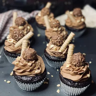 chocolate cupcakes with chocolate frosting and sprinkles