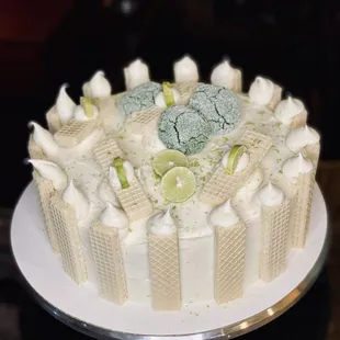 a cake with limes and marshmallows