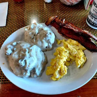 Amazing comfort dish of scrambled eggs, biscuits and Gravy with the best bacon I have EVER had!